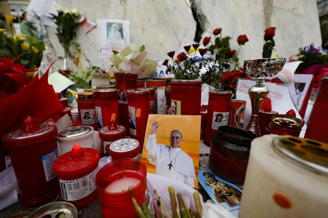 Tributes to Pope Francis outside Rome's Gemelli Hospital, where he is being treated.