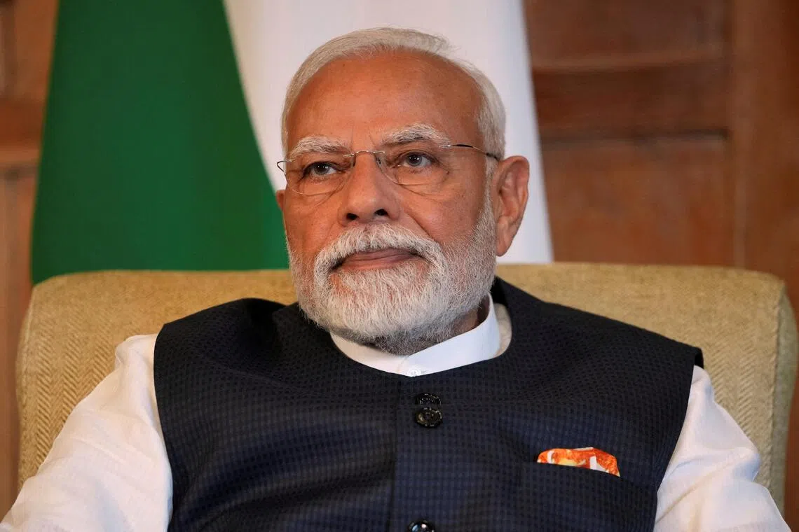FILE PHOTO: Prime Minister Narendra Modi of India listens to Britain's Prime Minister Keir Starmer (not pictured) as they meet for bilateral talks at Chequers near Aylesbury, England, Thursday, July 24, 2025.    Kin Cheung/Pool via REUTERS/File Photo