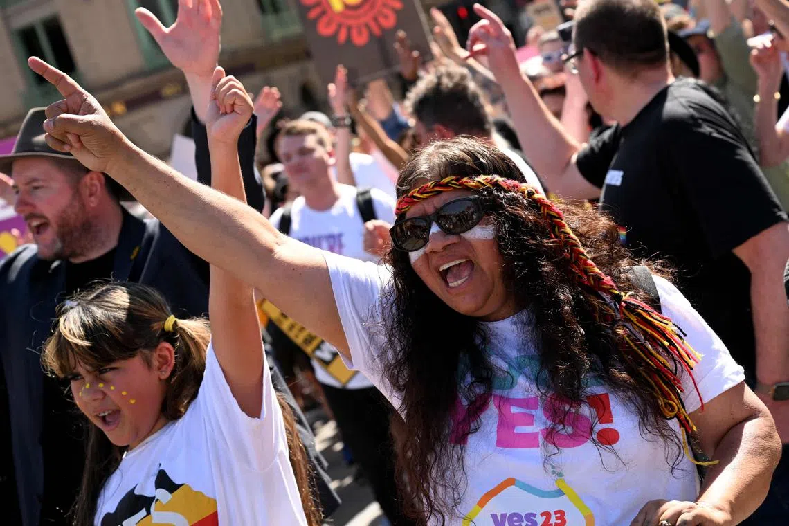 Crowds march during a "Walk for Yes" rally in Melbourne on Sept 17, 2023.
