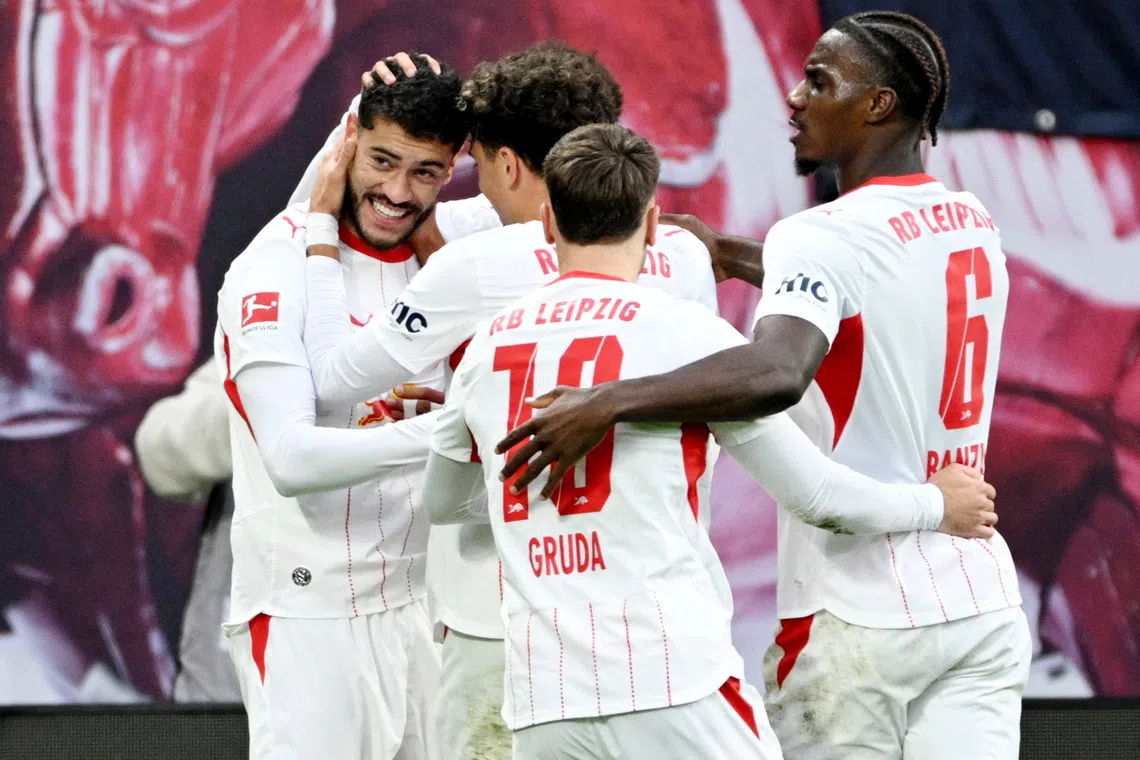 Soccer Football - Bundesliga - RB Leipzig v Elversberg - Red Bull Arena, Leipzig, Germany - October 24, 2026 RB Leipzig's Romulo celebrates scoring their second goal with teammates REUTERS/Annegret Hilse