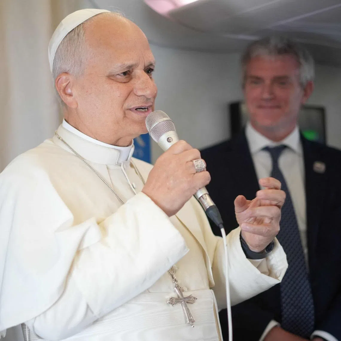 Pope Leo XIV speaks to journalists aboard the papal flight from Malabo to Rome, on April 23.