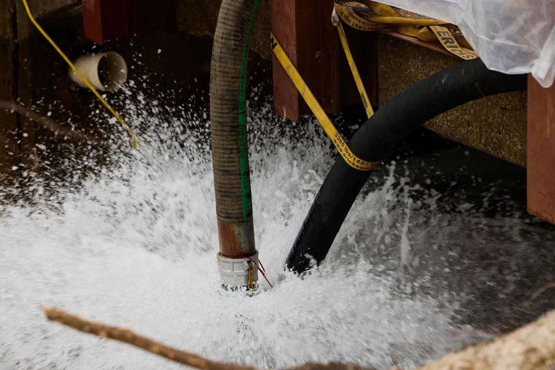 Water is pumped into a creek for aeration on Feb 14, 2023 in East Palestine, Ohio. 