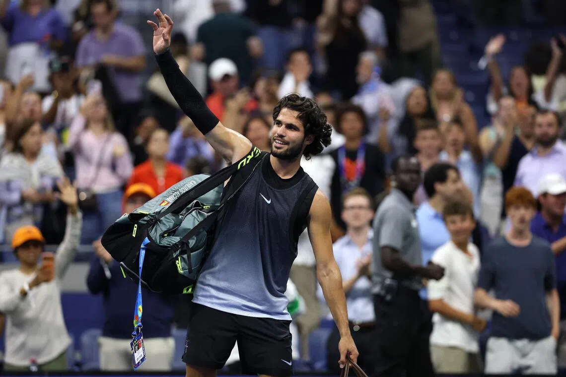 Carlos Alcaraz of Spain waving to the crowd as he exits the US Open on Sept 8 after losing to Ben Shelton. Their match ended at 3:33am local time.