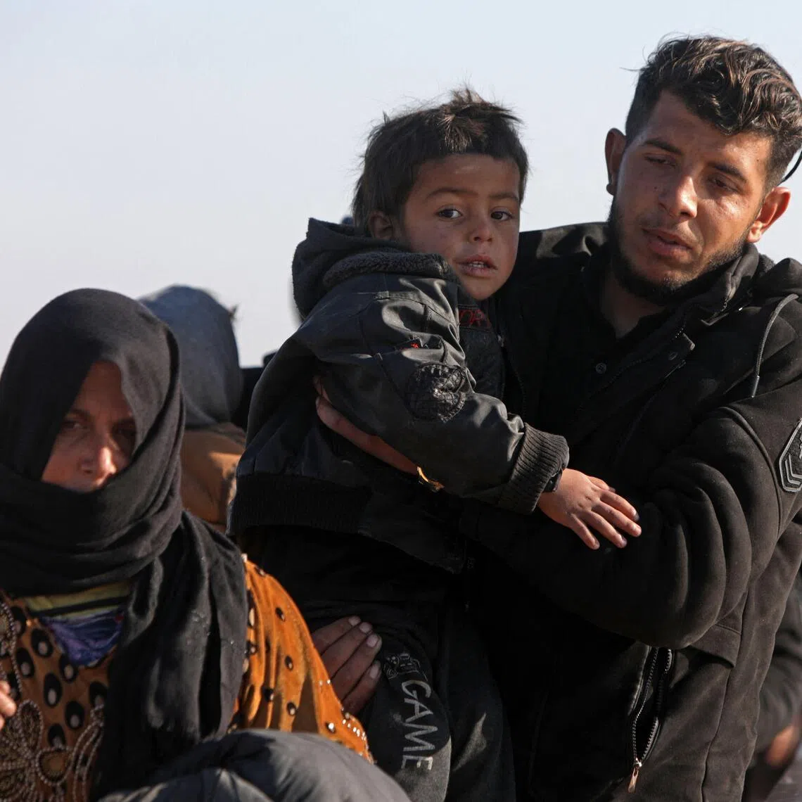 A family fleeing from a Kurdish-controlled area in Rasm al-Harmal, east of Aleppo city, on Jan 16.