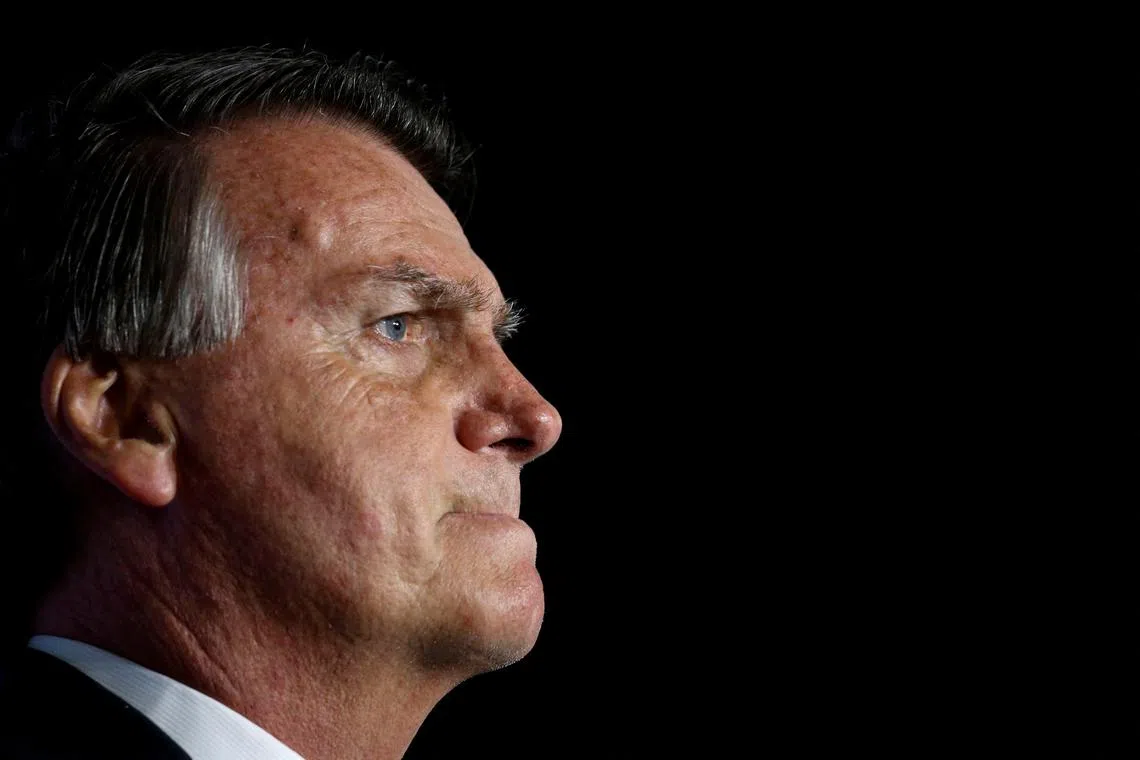 FILE PHOTO: Former Brazilian President Jair Bolsonaro looks on during \"Power of The People\" event hosted by Turning Point USA at Trump National Doral Miami Resort in Doral, Florida, U.S., February 3, 2023. REUTERS/Marco Bello/File Photo