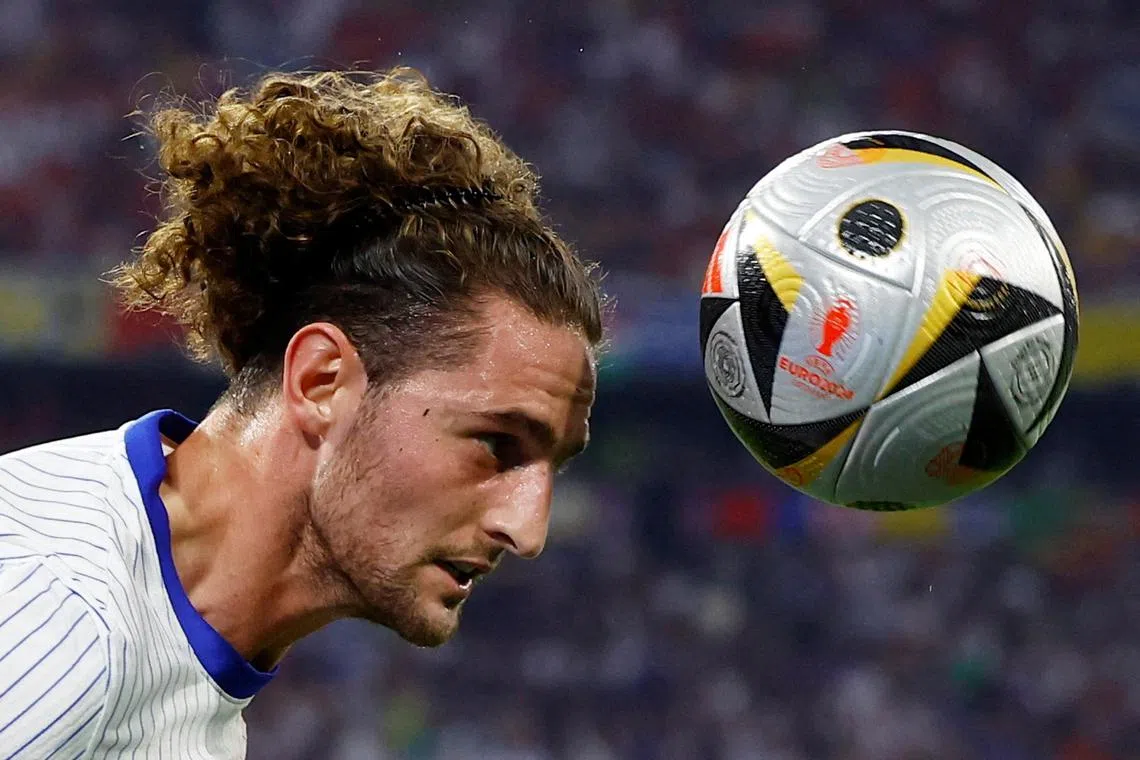 FILE PHOTO: Soccer Football - Euro 2024 - Semi Final - Spain v France - Munich Football Arena, Munich, Germany - July 9, 2024  France's Adrien Rabiot in action REUTERS/Michaela Stache/File Photo