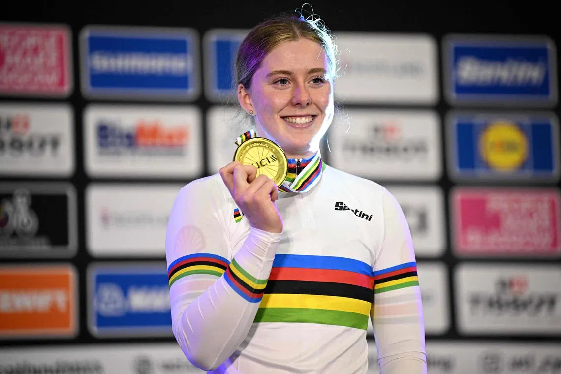Britain's Emma Finucane celebrates winning gold in the women's elite sprint final.