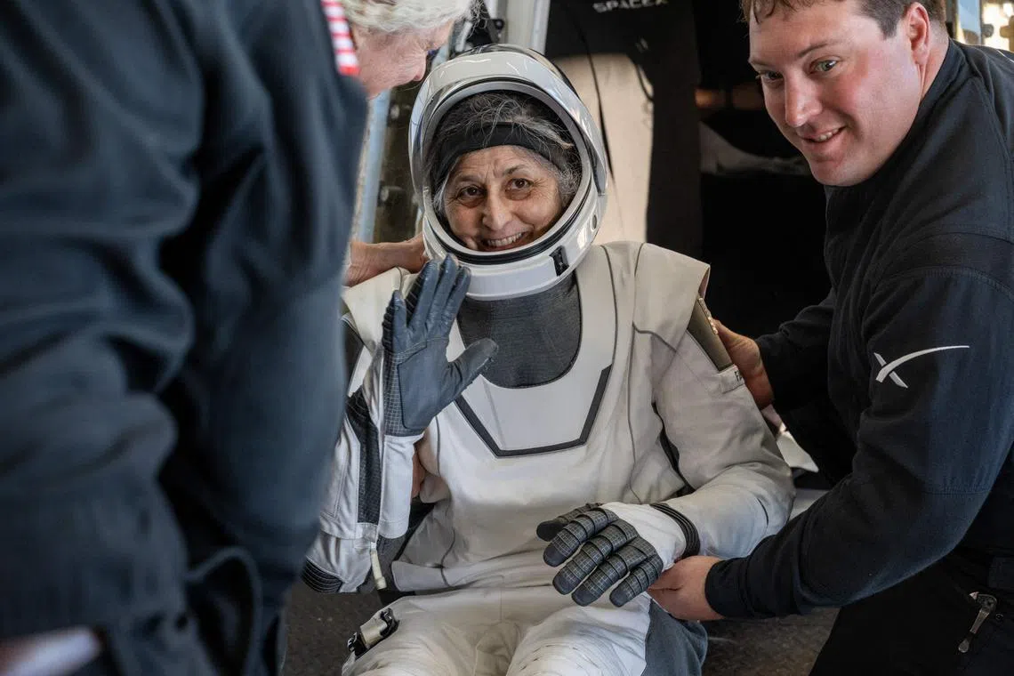 Astronaut Suni Williams being helped out of a SpaceX Dragon spacecraft on March 18.