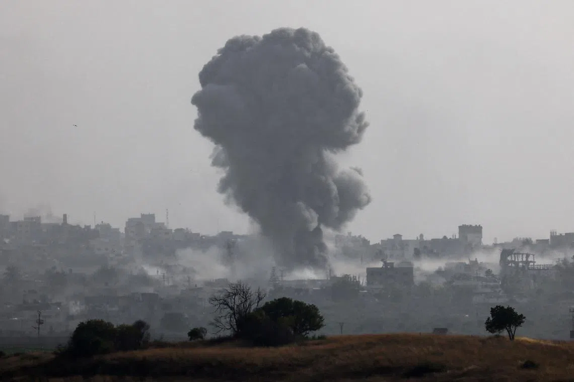 FILE PHOTO: Smoke rises from an explosion following an airstrike in Gaza, amid the ongoing conflict between Israel and the Palestinian Islamist group Hamas, near the Israel-Gaza border, as seen from Israel, May 20, 2024. REUTERS/Amir Cohen