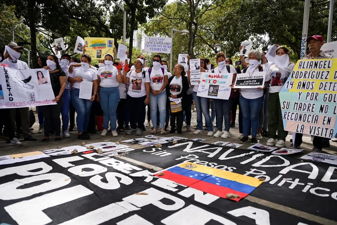 Relatives of Venezuelans detained during protests challenging the presidential election results, protest outside the public prosecutor's headquarters in Caracas, Venezuela, December 9, 2024. REUTERS/Gaby Oraa