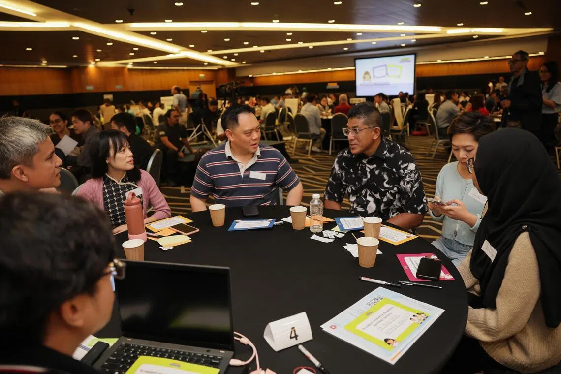 Darryl David (third from right), who chairs the government parliamentary committee on education, in a conversation with participants on June 27.