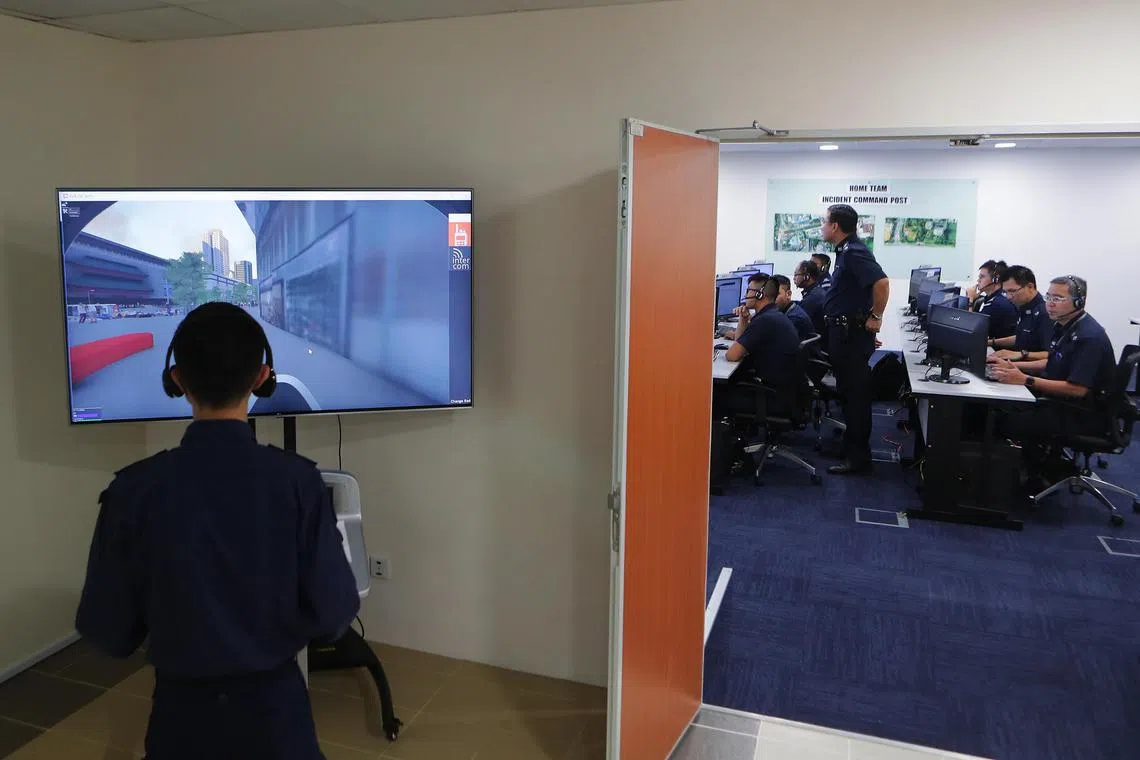Home Team officers using the Home Team Simulation System in a file photo from 2018.