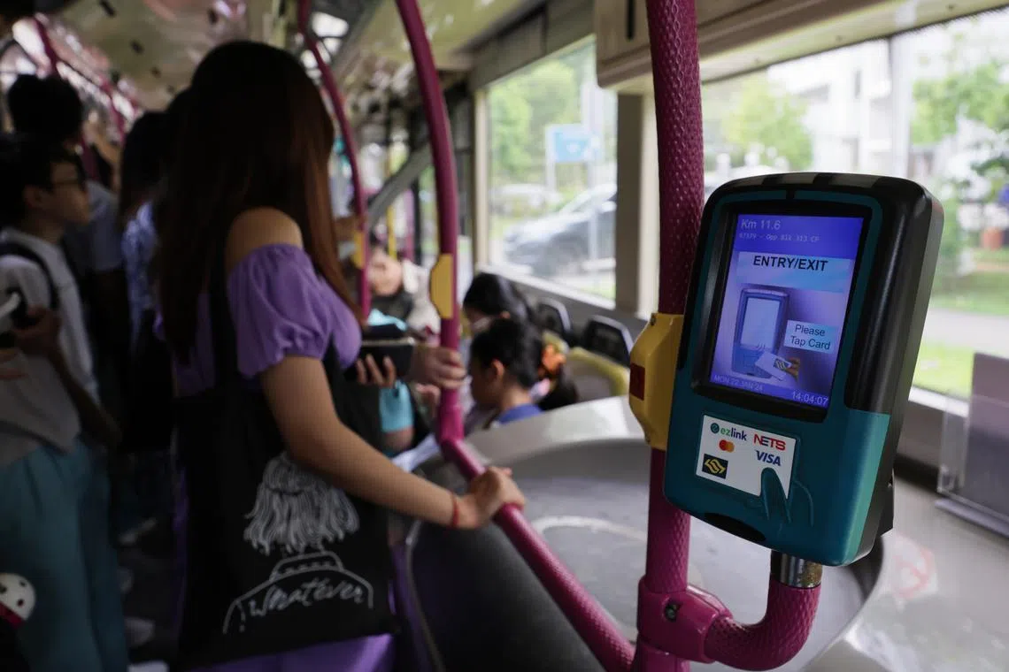ST20240122_202473769353 : Gin Tay / ntsimplygo22/ Generic photo of a bus fare reader onboard a SBS bus on Jan 22, 2024. can use for story on EZ-link card, bus fare reader, SimplyGo, LTA, public transport