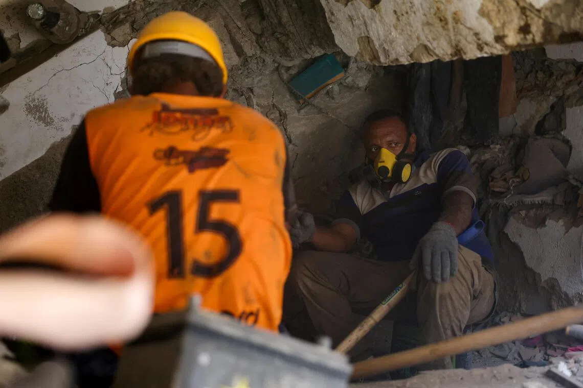 Nearly two months since the disaster, relatives and rescuers continue searching for the missing amid the rubble.