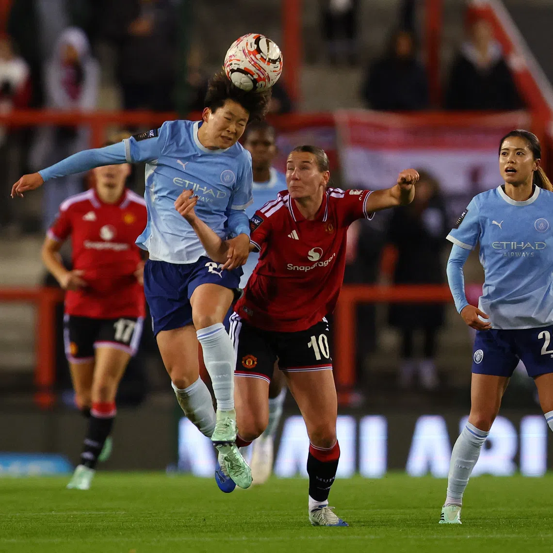 Soccer Football - Women's Super League - Manchester United v Manchester City - Leigh Sports Village, Leigh, Britain - October 25, 2026  Manchester City's Aoba Fujino in action with Manchester United's Elisabeth Terland Action Images via Reuters/Craig Brough