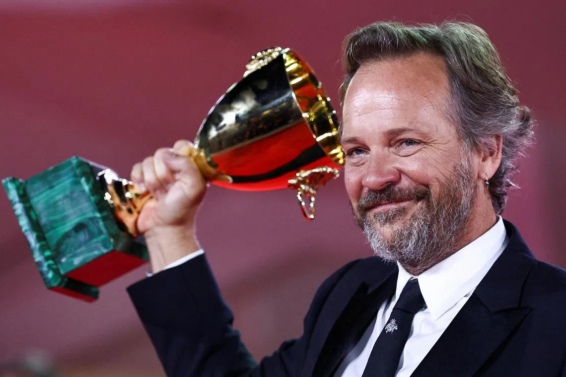 The 80th Venice Film Festival - Awards Ceremony - Venice, Italy, September 9, 2023. Actor Peter Sarsgaard poses with Coppa Volpi Award for Best Actor for the movie 'Memory'. REUTERS/Guglielmo Mangiapane