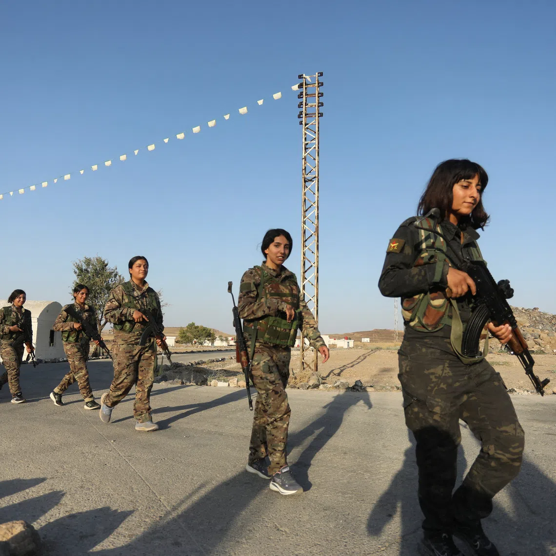 Women fighters from the Women's Protection Units (YPJ) take part in military traning in Hasakah, Syria, August 22, 2026. REUTERS/Orhan Qereman
