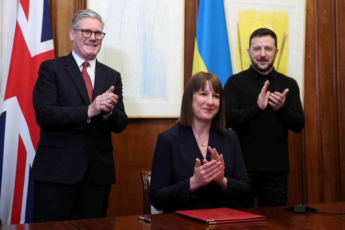(From left) British Prime Minister Keir Starmer, Britain's Chancellor of the Exchequer Rachel Reeves and Ukrainian President Volodymyr Zelensky at the signing of an air defence loan for Ukraine on March 1.