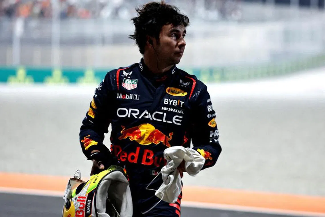 FILE PHOTO: Formula One F1 - Qatar Grand Prix - Lusail International Circuit, Lusail, Qatar - October 7, 2023 Red Bull's Sergio Perez leaves the track after crashing out of the sprint race REUTERS/Hamad I Mohammed/File Photo