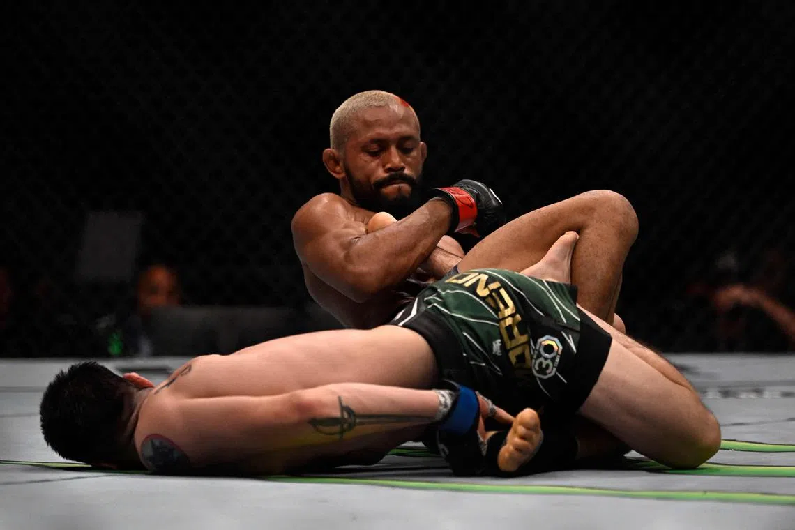 Brazilian Deiveson Figueiredo competes against Mexican Brandon Moreno during their flyweight title bout at the Ultimate Fighting Championship (UFC) event at the Jeunesse Arena in Rio de Janeiro, Brazil, on Jan 21.