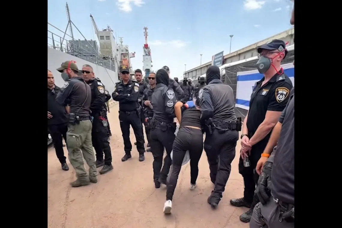 Footage released on May 20 showing a detained activist from the Gaza-bound aid flotilla. The activists who were arrested at a port in southern Israel will be deported to Turkey, officials said.