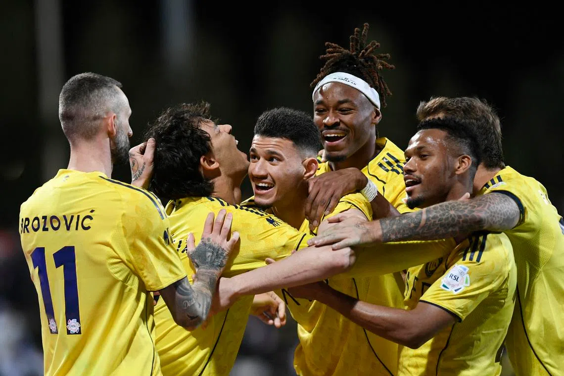 Soccer Football - Saudi Pro League - Al Fayha v Al Nassr - Al-Majma'ah Sports City Stadium, Al Majma'ah, Saudi Arabia - February 28, 2026 Al Nassr's Abdullah Al-Hamdan celebrates scoring their third goal with Joao Felix, Marcelo Brozovic, and teammates REUTERS/Stringer
