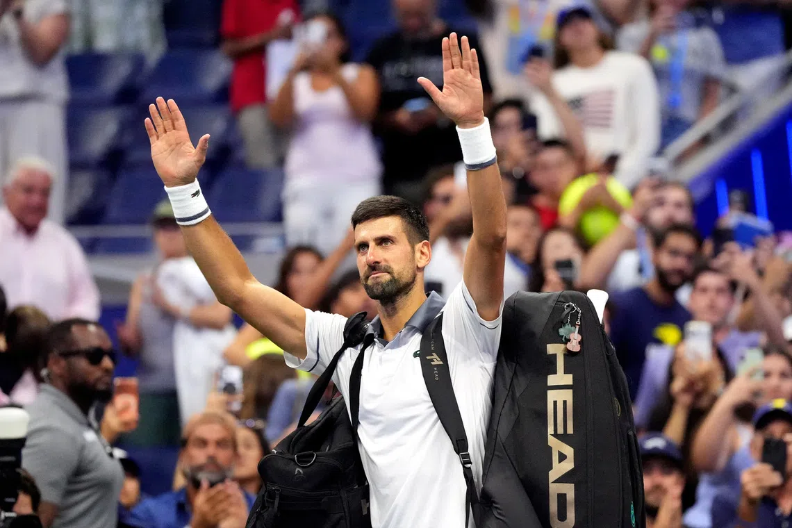 Novak Djokovic waves to the crowd after losing his US Open first-round match against Argentina’s Mariano Navone.