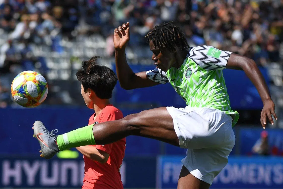 Nigeria's Asisat Oshoala and South Korea's Kim Hye-ri fighting for the ball during a France 2019 Women's World Cup Group A football match. Oshoala will be Nigeria's star player heading into the 2023 edition in Australia and New Zealand.