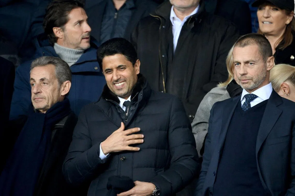 (From L) France's former president Nicolas Sarkozy, president of Paris Saint-Germain Nasser Al-Khelaifi and Uefa president Aleksander Ceferin attend the first leg of  the Champions League round of 16 match between PSG and Bayern Munich at the Parc des Princes stadium in Paris on Tuesday. 