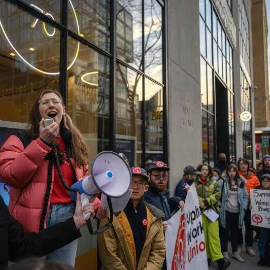 Union members protesting in New York against job cuts by Google's parent company Alphabet in 2023. The tech sector continues to shed jobs but AI is not entirely to blame, says the report. 