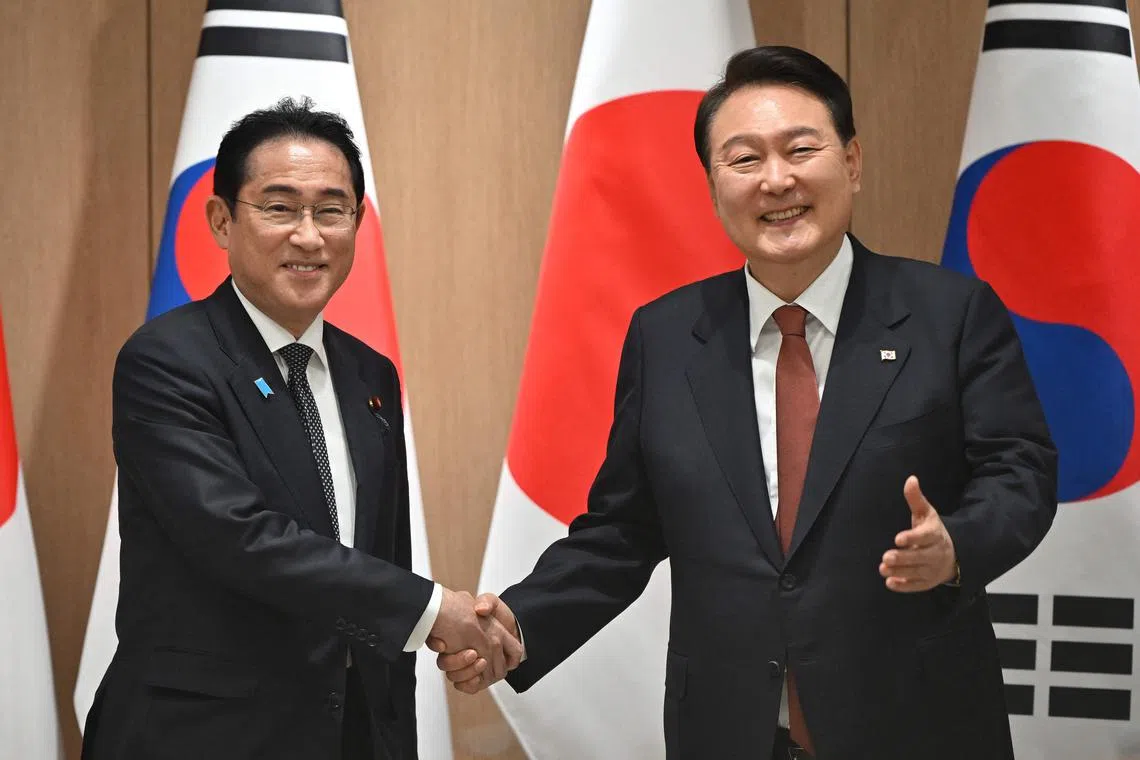 Japanese PM Fumio Kishida (left) meets South Korean President Yoon Suk-yeol at the presidential office in Seoul on May 7, 2023.
