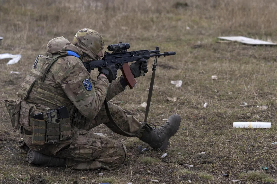 A Ukrainian serviceman undergoes military training in Ukraine's Donetsk region.
