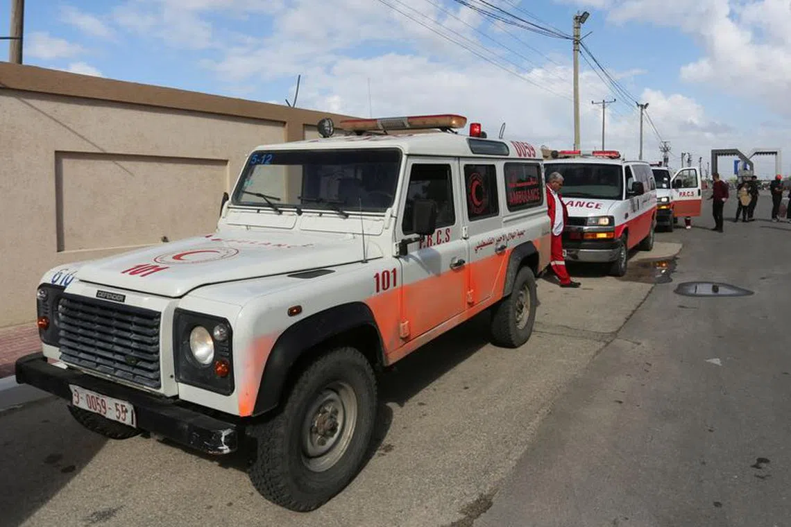 FILE PHOTO: A man walks next to ambulances carrying premature babies, who were evacuated from Al Shifa hospital, before they are transported for treatment in UAE, at Rafah border crossing with Egypt, in Rafah, in the southern Gaza Strip, November 20, 2023. REUTERS/Hatem Khaled/File Photo