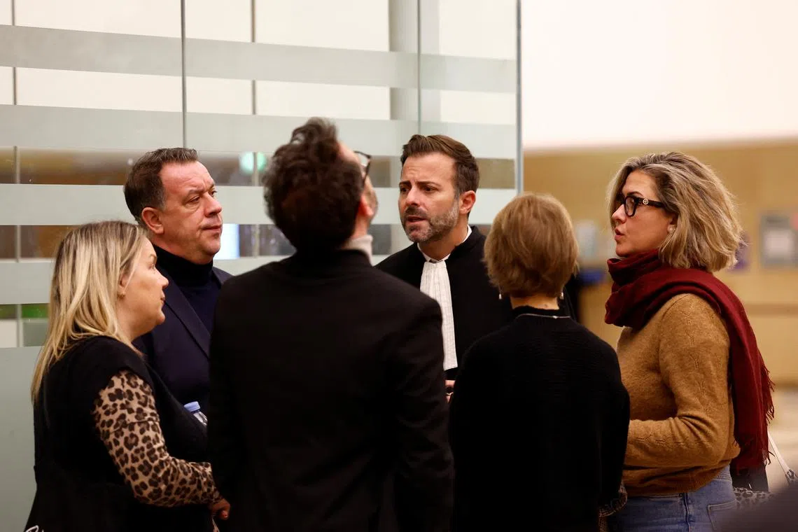 Caroline Darian, David and Florian, the children of Frenchwoman Gisele Pelicot, talk with lawyer Antoine Camus on Nov 18.