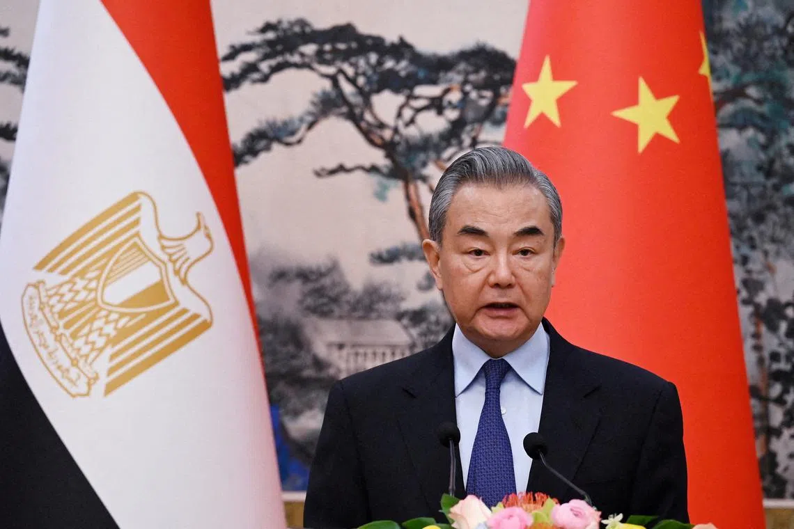 FILE PHOTO: Chinese Foreign Minister Wang Yi in Beijing’s Diaoyutai State Guesthouse on December 13, 2024.  GREG BAKER/Pool via REUTERS//File Photo
