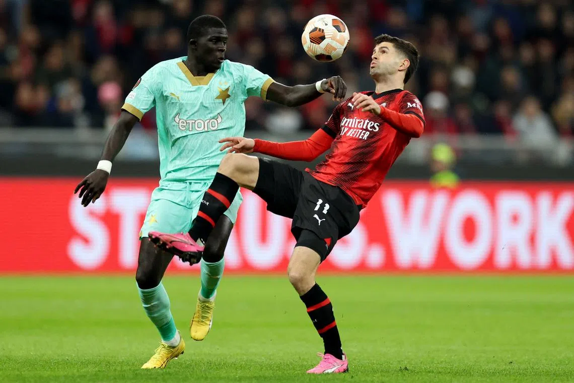 Soccer Football - Europa League - Round of 16 - First Leg - AC Milan v Slavia Prague - San Siro, Milan, Italy - March 7, 2024 AC Milan's Christian Pulisic in action with Slavia Prague's El Hadji Malick Diouf REUTERS/Claudia Greco/File Photo