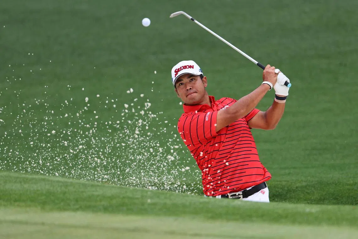 Japan's Hideki Matsuyama playing out from the bunker on the 2nd green during a practice round ahead of the Masters at Augusta National.