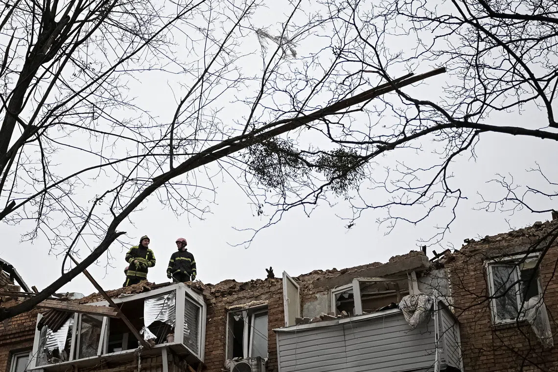 Rescuers work at the site of the apartment building hit by a Russian drone during a Russian missile and drone strike, amid Russia's attack on Ukraine, in Kyiv, Ukraine December 27, 2025. REUTERS/Viacheslav Ratynskyi