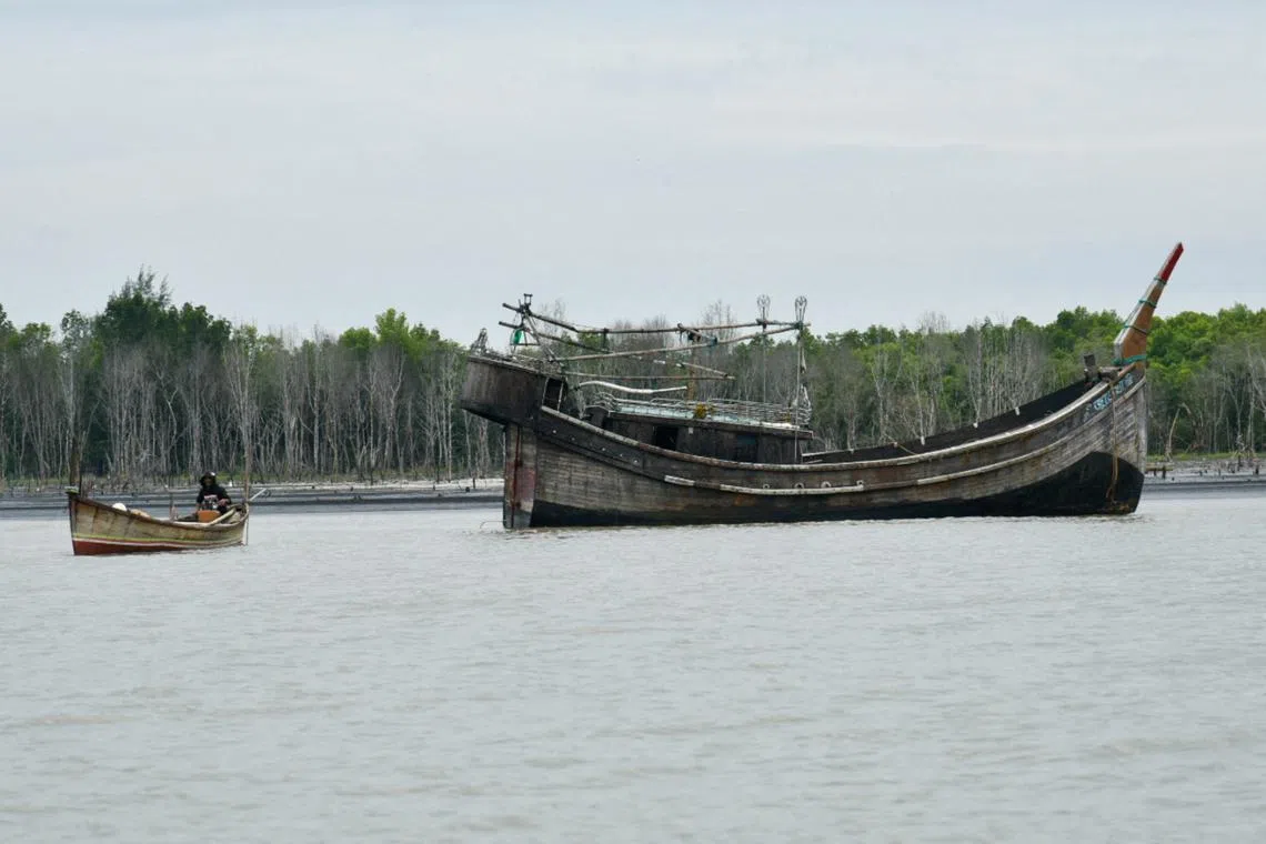 FILE PHOTO: A wooden boat that carried Rohingya Muslims floats off the coast of Karang Gading village, Deli Serdang, North Sumatra province, Indonesia, January 1, 2024, in this photo taken by Antara Foto. Antara Foto/Fransisco Carolio/via REUTERS/File Photo