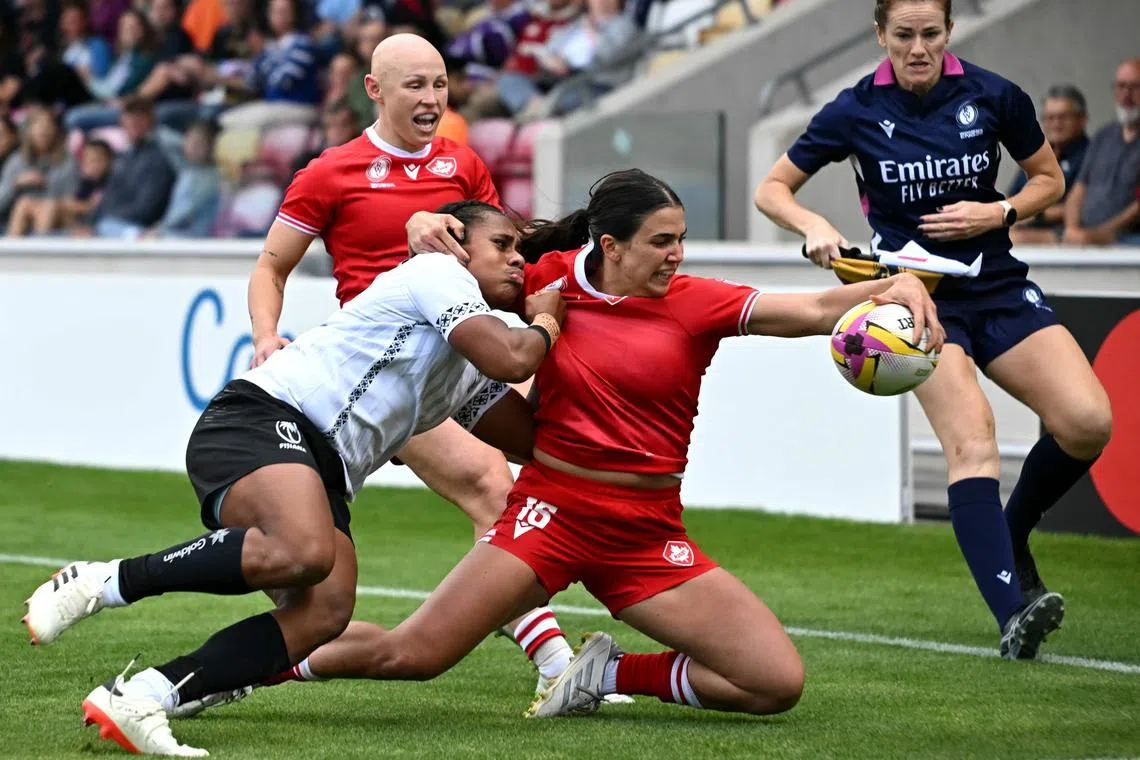 Canada's fullback Julia Schell scoring one of her six tries during the Women’s Rugby World Cup pool B match between Canada and Fiji at York Community Stadium in York, northern England, on August 23, 2025. (Photo by Paul ELLIS / AFP)