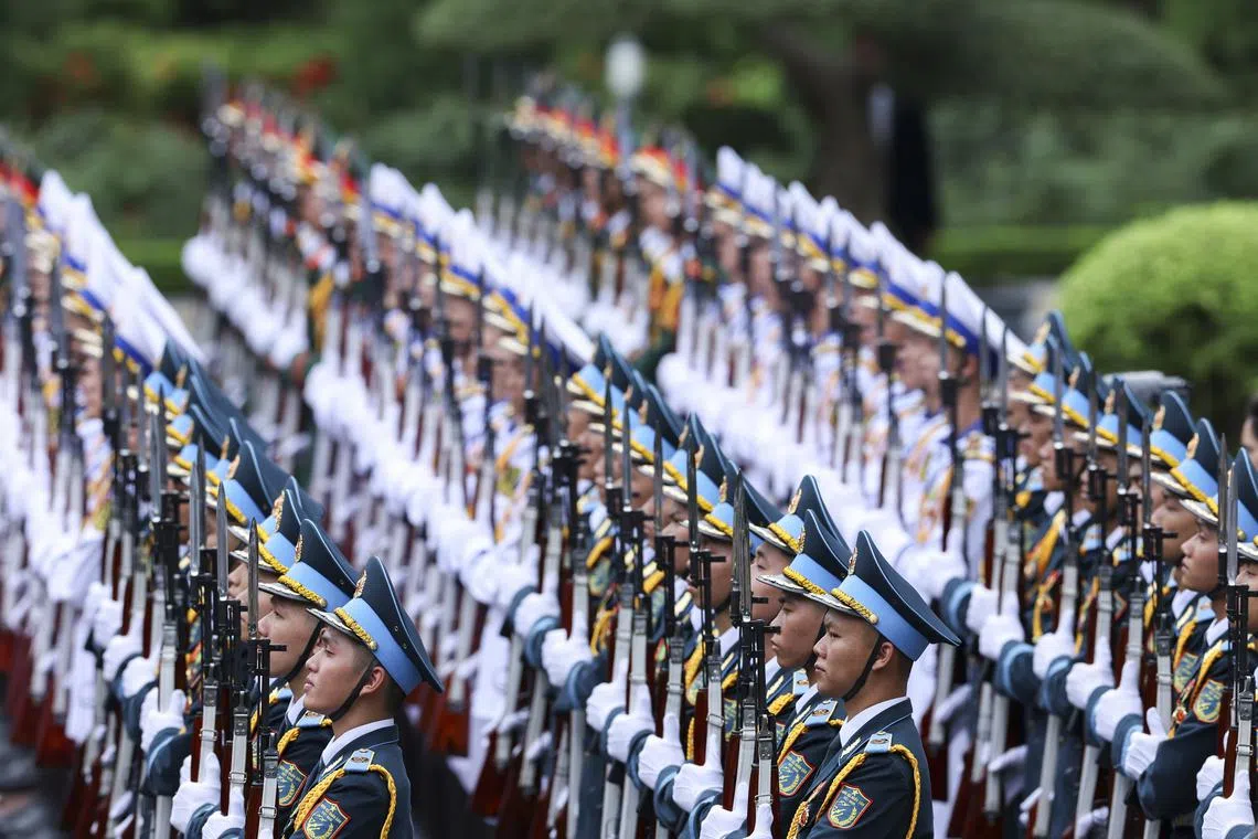 Members of the honour guard standing in formation during the welcome ceremony for French President Emmanuel Macron hosted by Vietnam's President Luong Cuong, at the Presidential Palace in Hanoi, Vietnam, on May 26, 2025. 