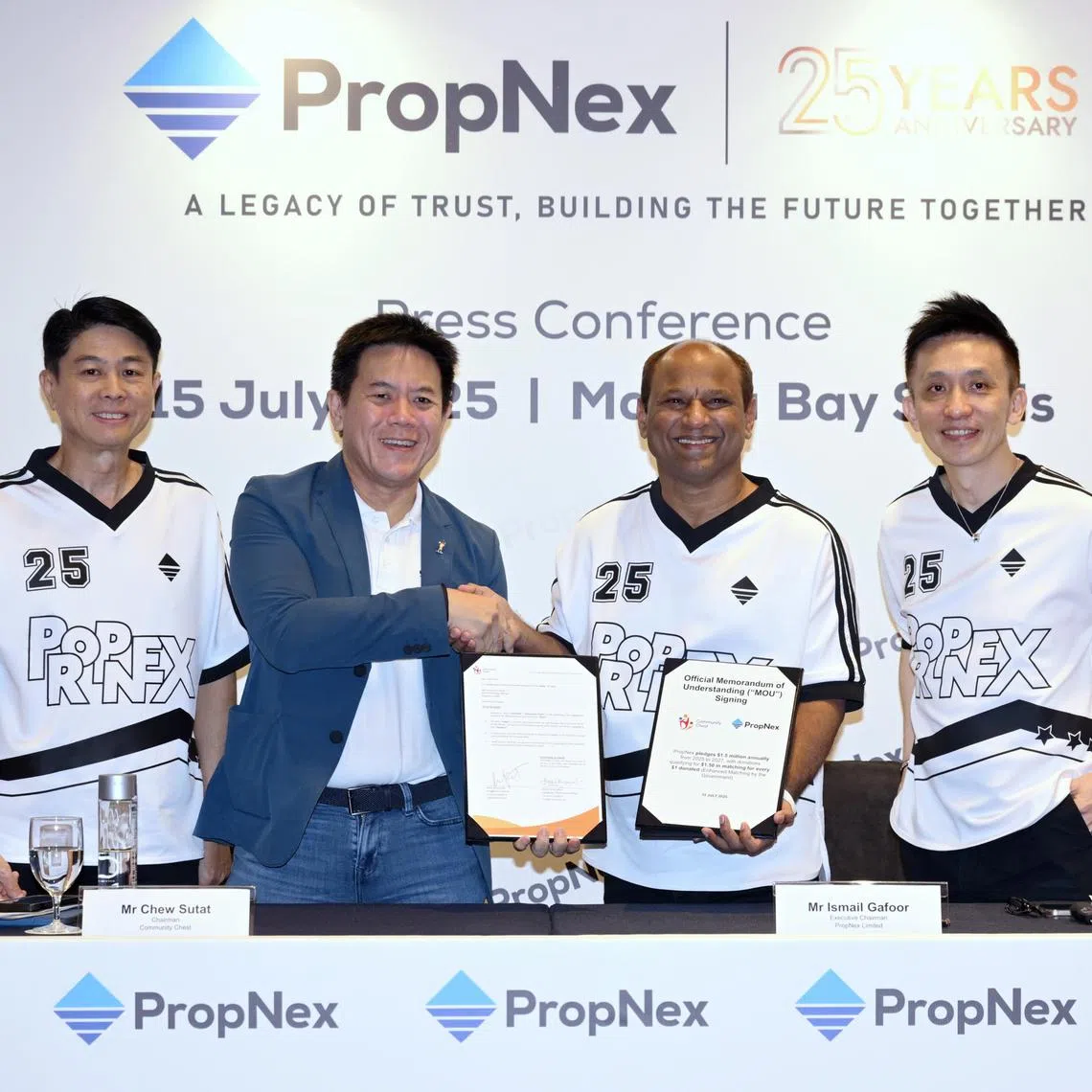 (L-R) Co-founder, PropNex Limited, Mr. Alan Lim, Chairman of Community Chest, Mr. Chew Sutat, Executive Chairman, PropNex Limited, Mr. Ismail Gafoor and Executive Director and CEO, PropNex Limited, Mr. Kelvin Fong at a MOU-signing ceremony on July 15, 2025.