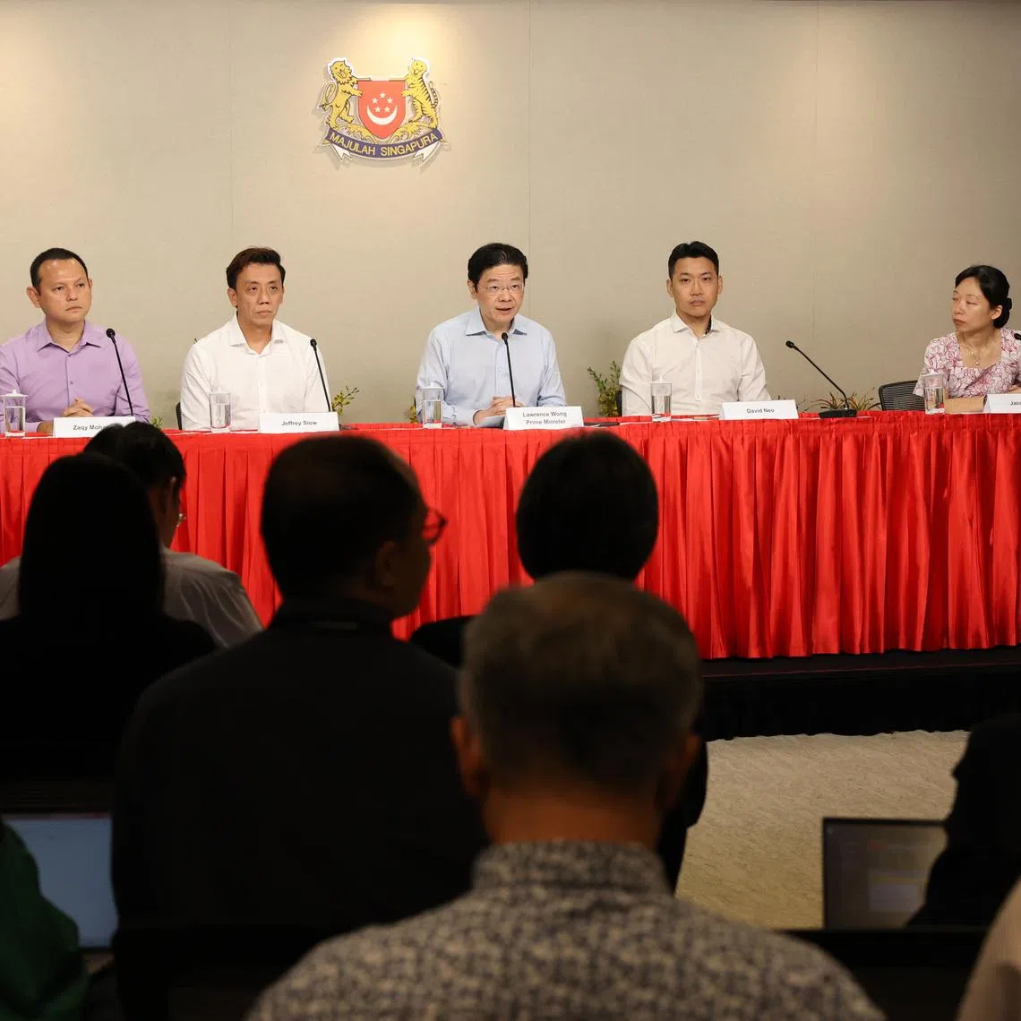 PM Lawrence Wong (third from right) announcing a Cabinet reshuffle at a press conference on July 22. With him are (from left) Goh Pei Ming, Zaqy Mohamad, Jeffrey Siow, David Neo and Jasmin Lau.