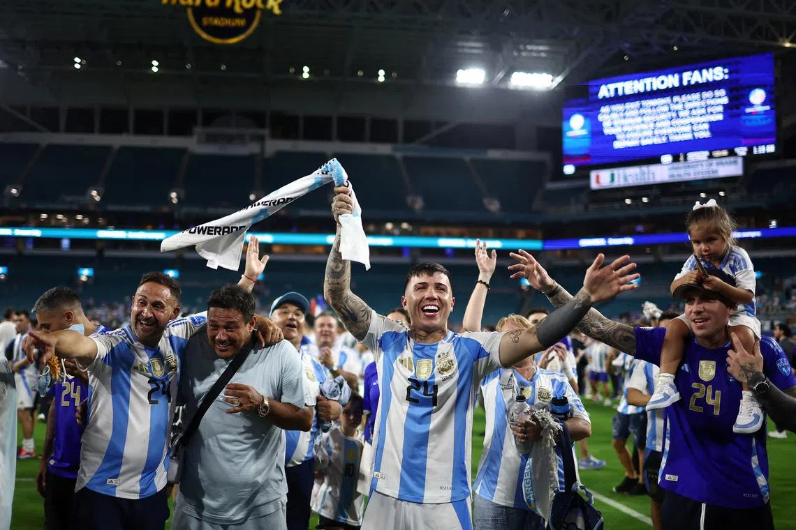 FILE PHOTO: Soccer Football - Copa America 2024 - Final - Argentina v Colombia - Hard Rock Stadium, Miami, Florida, United States - July 15, 2024 Argentina's Enzo Fernandez celebrates with family after winning the Copa America 2024 REUTERS/Agustin Marcarian/File Photo