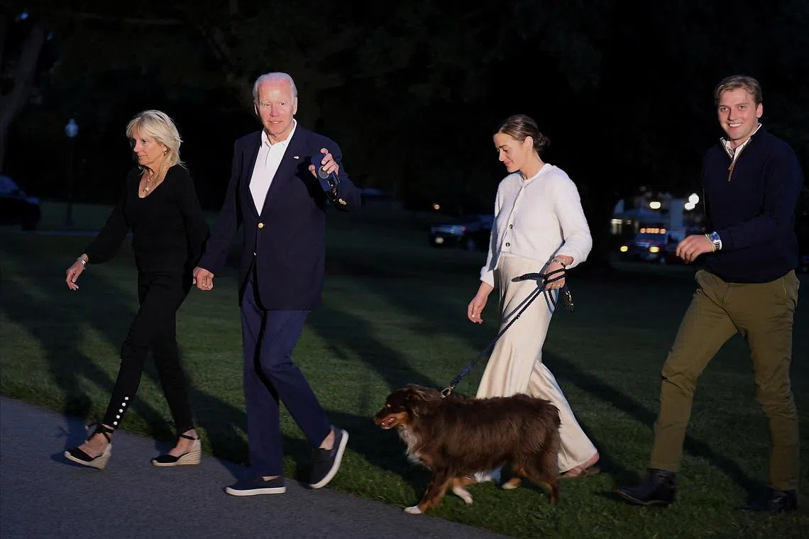 US President Joe Biden, First lady Jill Biden, their granddaughter Naomi Biden, her fiance Peter Neal walk to the White House on June 20, 2022. 