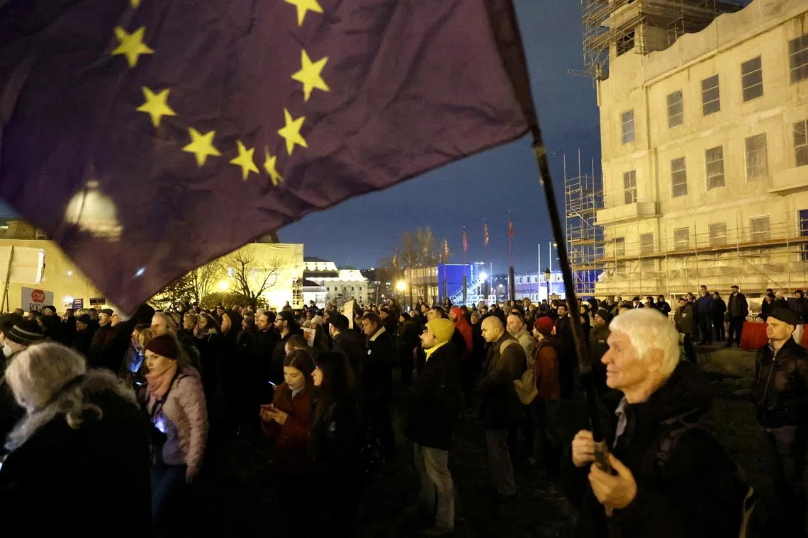 FILE PHOTO: Supporters of Hungary's opposition demonstrate outside Prime Minister Viktor Orban's office calling on him to resign after the resignation of the country's president and former justice minister in Budapest, Hungary, February 14, 2024. REUTERS/Bernadett Szabo/File Photo