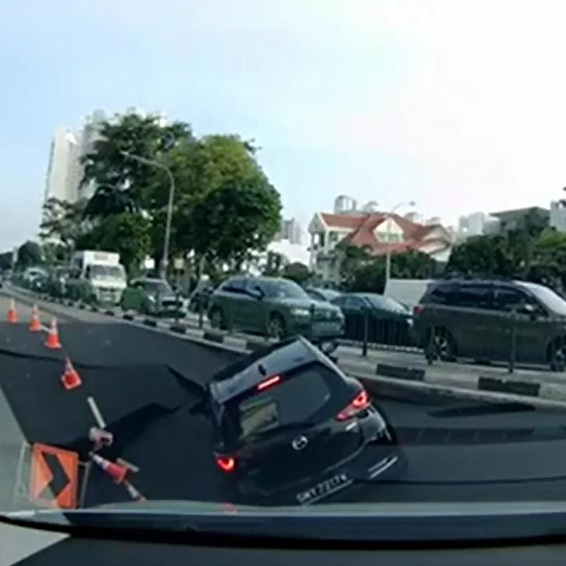 The sinkhole formed after a failure at a nearby worksite, causing a car and its driver to fall into it on July 26, 2025.