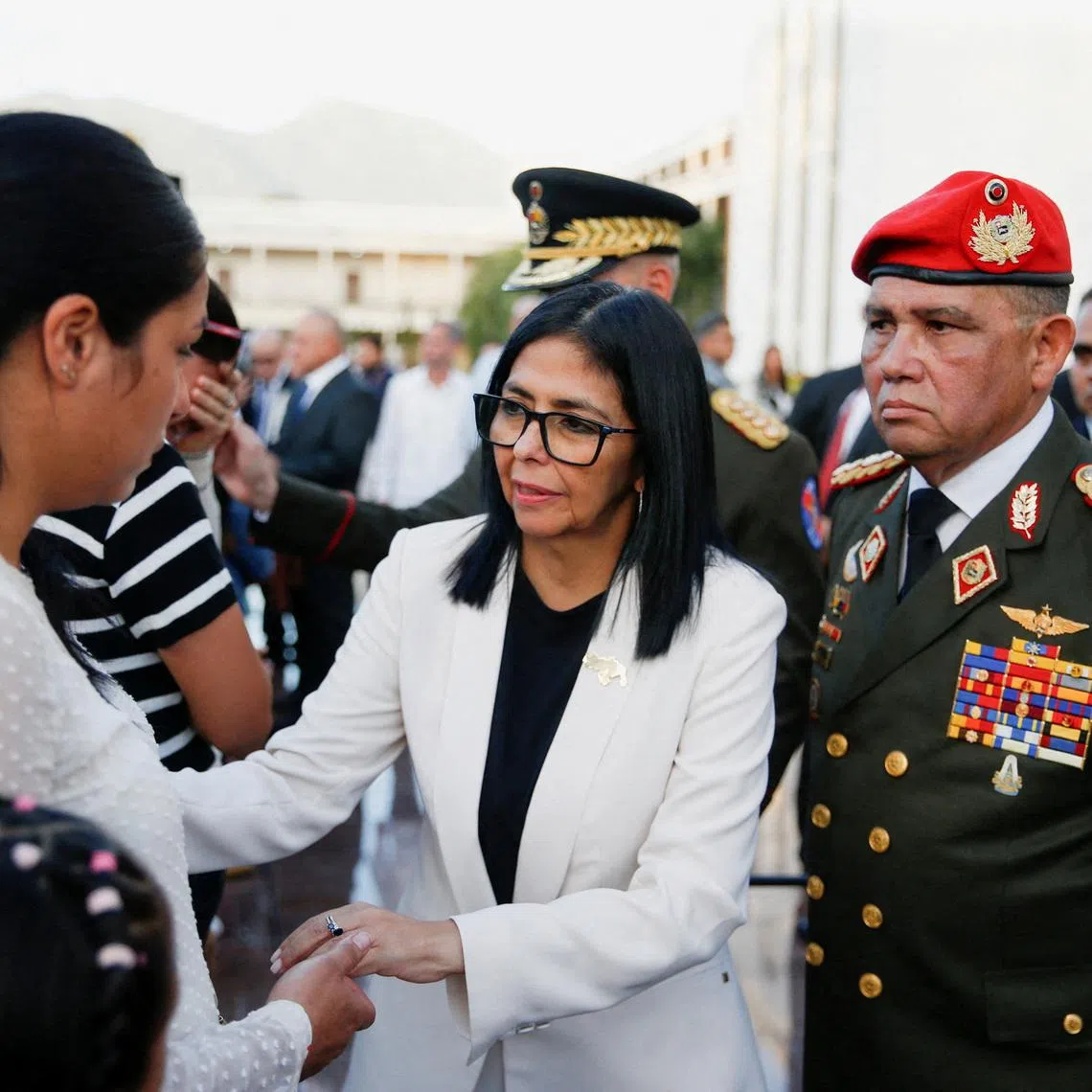 FILE PHOTO: Venezuela's interim president Delcy Rodriguez and General Gustavo Gonzalez Lopez at a ceremony honouring Venezuelan and Cuban military and security personnel who died during a U.S. operation to capture Venezuela’s President Nicolas Maduro and his wife Cilia Flores, in Caracas, Venezuela January 8, 2026. REUTERS/Leonardo Fernandez Viloria/File Photo