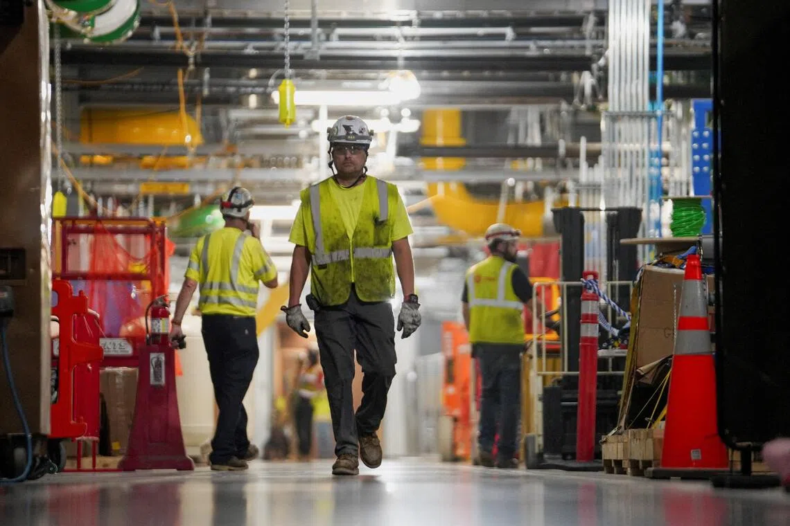 People work inside Microsoft’s data centre currently under construction at Mount Pleasant, Wisconsin.