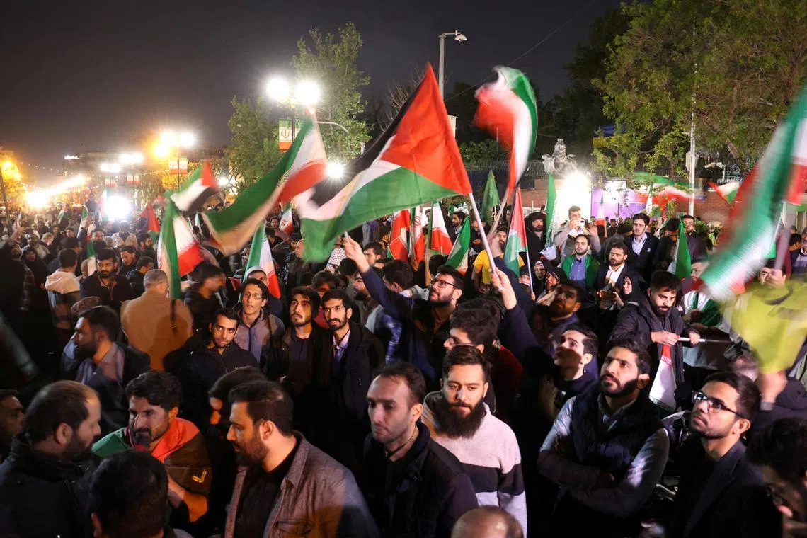 Iranian demonstrators attend an anti-Israeli gathering in front of the British Embassy in Teheran, on April 14, 2024.